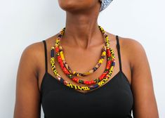 African fabric necklace, Ankara layered necklace, Statement necklace, African print necklace, Christmas gift for her, Moms gift A beautiful Ankara necklace that can compliment any outfit 3-5 days delivery via DHL Express. Pay shipping fee for the first item only and additional items ship for FREE. To view more items in our shop, kindly click here: nkoroicrafts.etsy.com Ankara Necklace, Necklace African, Fabric Necklace, Christmas Gift For Her, Necklace Statement, Choker Necklaces, African Fabric, Christmas Gifts For Her, 10k Gold