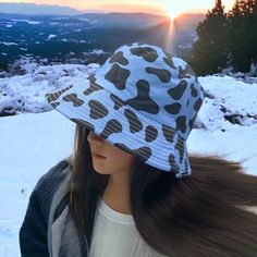 Dare to be bold and stand out wherever you go with this fun and unique cow print bucket hat! Featuring a reversible black and blue design, and a 2.5" brim, this hat will turn heads and add style to your every look! With a one-size-fits-most design, you'll have the perfect fit for your next adventurous outing. Cow Print Bucket Hat, Red Bucket Hat, Crochet Pony, Sage Blue, Reversible Bucket Hat, Black Cow, Crochet Bucket Hat, Slouch Hat, Handcrafted Accessories