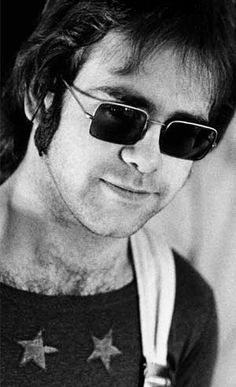 black and white photograph of a man wearing sunglasses