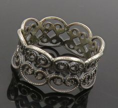 925 Sterling Silver - Vintage Dark Tone Pretzel Knot Band Ring Sz 5 - RG16151  925 Sterling Silver - Vintage Dark Tone Pretzel Knot Band Ring Sz 5 - RG16151  Jewelry Type:         Ring  Metal Type:            925 Silver  Metal Size:             5 Finger  Stone Type:            N/A  Condition:              N/A  Jewelry Weight:     2 Grams  PLEASE NOTE: THIS ITEM IS PRE-OWNED. ALTHOUGH MOST ITEMS ARE IN VERY GOOD CONDITION, SOME MAY NEED CLEANING AND/OR MINOR REPAIRS. WE MAKE A VERY STRONG EFFORT TO UPLOAD CLEAR PICTURES. PLEASE INSPECT ALL PICTURES AND ASK ALL QUESTIONS YOU MAY HAVE PRIOR TO MAKING A PURCHASE. NOT ALL STONES ARE GENUINE, SOME ARE ENHANCED OR CREATED. Antique Silver Rings With Decorative Band, Antique Silver Ring With Decorative Band, Elegant Oxidized Filigree Ring For Anniversary, Vintage Round Filigree Ring With Oxidized Finish, Vintage Silver Ring With Decorative Band, Victorian Silver Jewelry With Decorative Band, Vintage Silver Open Band Jewelry, Vintage Sterling Silver Jewelry With Decorative Band, Victorian Style Silver Metal Rings