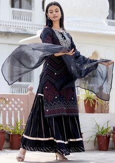 This is 3 piece set.It comes with bandhani print kurta teamed with flared sharara and a dupatta to match. 3 Piece Set Fabric-Cotton Color-Black Work-Bandhani print, embroidered, sequins work with front & side tassels Kurta Detailing-Calf length kurta with side slits Bottom-Flared Sharara Sleeves-3/4th Sleeves Neck-Round Neck Occasion-Festive wear Washing care-Hand wash Embroidered Sharara, Bandhani Print, Sharara Suit, Match 3, Suit Set, Festival Wear, 3 Piece, Round Neck, Floral Prints