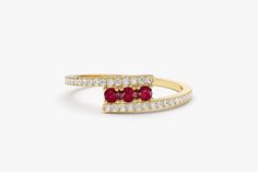 "Ruby and Diamond Ring / 14k Solid Gold Cross Over Diamond and Ruby Ring / Dainty Ruby Ring / July Birthstone Ring by Ferkos Fine Jewelry *Made to Order *Gold Kt: 14K (also available in 18K) *Available Gold Color: Rose Gold, Yellow Gold, White Gold *Round Diamond: 32 pcs 1.0 MM *Round Ruby: 3 pcs 2.0 MM *Diamond Carat Weight: 0.15 ctw *Ruby Carat Weight: 0.15 ctw * Diamond Color-Clarity: G Color SI Clarity If you have any additional questions about this ring, just hit the \"Message Ferko\" butto Elegant Multi-stone Birthstone Promise Ring, Elegant Multi-stone Stackable Rings For Anniversary, Elegant Multi-stone Promise Ring, Elegant Gemstone Bypass Ring For Anniversary, Fine Jewelry Anniversary Bypass Ring With Gemstone, Anniversary Fine Jewelry Bypass Ring With Gemstone, Fine Jewelry Gemstone Bypass Ring For Anniversary, Dainty Ruby Ring, Diamond And Ruby Ring