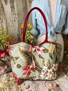 Wanting to get into a relaxed island state of mind? Go for a Tiki-rific Lolita featuring a tropical motif in soft colors and florals.

The Atenti Tiki Lolita is an open tote with a magnetic closure and a large detachable interior pouch measuring 12" wide x 10" high x 3" deep in a matching fabric. Both pieces are fully lined with water resistant taffeta. The outside shell bag features a zippered pocket and an open divided pocket with a cell phone slot. Atenti Lolita measures 17" wide x 11" tall x Tropical Style Tote Beach Bag For Everyday Use, Floral Print Tote Shoulder Bag For Vacation, Vacation Floral Print Tote Shoulder Bag, Tropical Rectangular Beach Bag, Bohemian Floral Print Bags For Vacation, Floral Print Beach Tote Bag, Beach Tote Bag With Floral Print, Green Floral Print Beach Bag, Tropical Style Beach Bag For Daily Use