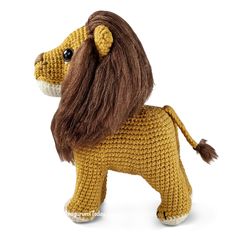 a crocheted lion is shown on a white background