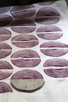 a close up of a table cloth with circles on it and a circular object in the middle