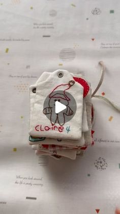 a person is holding some cloths with an elephant on them and the tag says cling