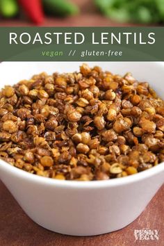 roasted lentils in a white bowl on a wooden table