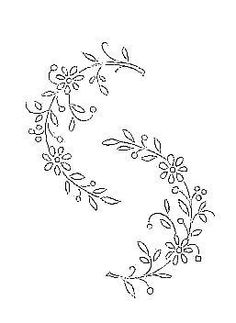 the embroidery design is shown in black and white, with small flowers on each side