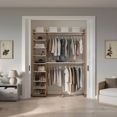 an open closet with clothes on hangers and other items in the room next to it