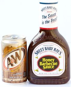 a bottle of honey barbecue sauce next to a can of sweet baby rails bbq