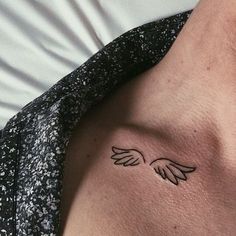 a person with a small tattoo on their chest