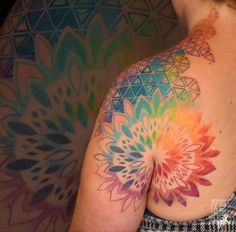 a woman with a colorful tattoo on her back