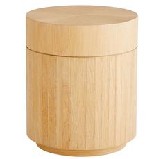 a round wooden box sitting on top of a white surface