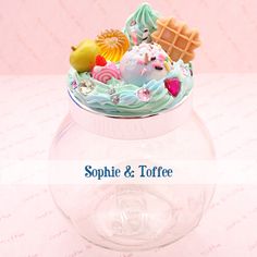 there is a small bowl with food in it on top of a table that says, sophiie & toffee