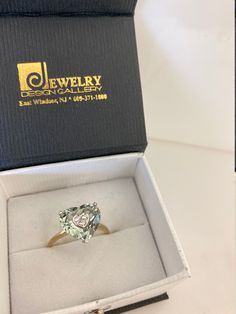 "This stunning ring is made from 14-karat two tone gold and set with beautiful heart shape of mint-green amethyst that set with three small sparkling diamonds at the center of the amethyst - which is said to have a calming effect on the soul and spirit. We believe this would be a thoughtful gift to give or treat to yourself. Material: 14k two tone gold Stone/Pendant: Green amethyst measures approximate 12.5 x 12.0 mm Diamonds: Approximate weigh 0.10-carats total Ring size: 9 US Weight: 3.3 grams Soul And Spirit, Green Amethyst Ring, Platinum Wedding, Halo Earrings Studs, Amethyst Gem, Gold Stone, Green Amethyst, Beautiful Heart, Diamond Sizes