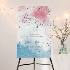 a blue and pink watercolored wedding sign with gold glitters on the bottom