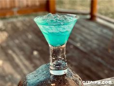 a blue drink sitting on top of a wooden table