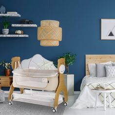 a baby crib in a bedroom with blue walls and white carpeted flooring