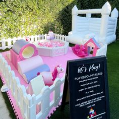 an inflatable play ground is set up on the lawn