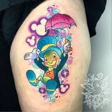 a cartoon character with an umbrella tattoo on the thigh