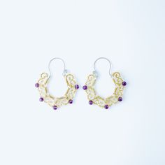 Stainless Steel and Brass Earrings with Amethyst Gemstone and Clear Crystals.• Sold in pairs• Material: High Quality Stainless Steel and Brass• Gemstone: Amethyst and Clear Crystals• Size Hoops 60mm x 50mm• Waterproof earrings Waterproof Earrings, Birthstone Earrings, In Pairs, Amethyst Jewelry, Gold Piece, Birthstone Earring, Clear Crystals, Amethyst Earrings, Brass Earrings