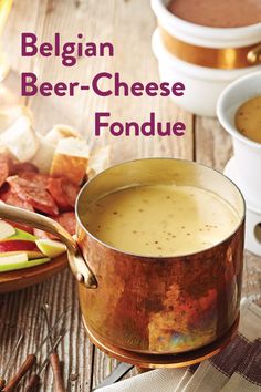 an image of a beer cheese fondue in a pot with apples and cinnamons on the side