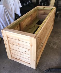 a large wooden box sitting on top of a floor