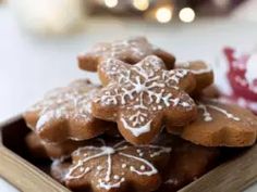 a wooden box filled with cookies on top of a table