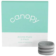 an image of aroma puck 3 - pack with packaging on white and light blue background