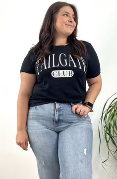 Tailgate Club Graphic Tee Show off your game day spirit with the Tailgate Club Graphic Tee. Perfect for sporting events or casual hangouts, this tee features a fun and bold graphic that celebrates the best of tailgating traditions. Size: S-L Color: Black Leopard Loafers, Baby Pearls, Footie Pajama, Skirt Jumpsuit, Dressy Dresses, Curvy Dress, Plaid Tops, Fitted Sweater, Long Sleeve Cardigan