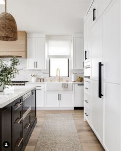 the kitchen is clean and ready for us to use it's white cabinetry