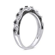 a white gold ring with black and white diamonds