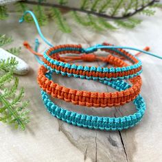 "Matching bracelet for family, made of waxed cord. These waterproof adjustable bracelets are the perfect combination to wear on Season Football Game. These Football Team bracelets were designed for everyday wear. These minimalist boho Turquoise and Orange cord bracelets enhance your casual outfit. ♥ ITEM DETAILS: Total length: The size of the bracelet is adjustable. 💕The bracelet has an adjustable closure that will work on a wrist of about 6 - 7\"💕 Materials: Waxed cord. Waxed Cord Available: Casual Orange Braided Bracelets For Friendship, Casual Orange Braided Bracelet For Friendship, Casual Handmade Orange Friendship Bracelets, Handmade Orange Casual Friendship Bracelet, Casual Handmade Orange Friendship Bracelet, Adjustable Orange Friendship Bracelets, Adjustable Orange Friendship Bracelets With Sliding Knot, Adjustable Orange Friendship Bracelet With Sliding Knot, Adjustable Orange Macrame Jewelry