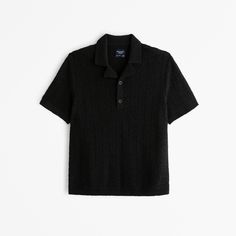 Elevate your casual wardrobe with the Abercrombie & Fitch Men's Camp Collar Cropped Sweater Polo. This unique piece combines comfort and style, making it a must-have for any fashion-forward individual.

- Material: Cotton, Viscose blend for softness and durability
- Color: Classic Black
- Size: XS
- Features: Lightweight, short-sleeve design in a sweater-knit fabric
- Details: Slightly boxy, cropped silhouette with handcrafted-style stitching
- Additional Features: Two-button placket, resort-sty Male Features, Sweater Polo, Button Sweater, Lightweight Shorts, Cotton Viscose, Resort Style, Fabric Details, Short Sleeved Sweaters, Sweater Knit