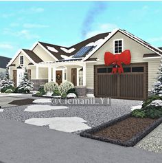 a house with a red bow on it's front door and snow covered driveway