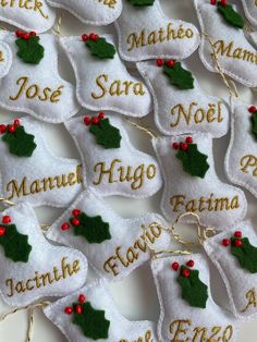 christmas stockings with name tags and holly decorations