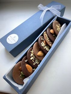 a blue box filled with chocolate covered desserts