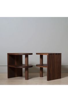 two wooden tables sitting next to each other