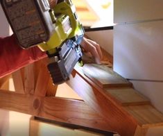 a person using a power tool to cut wood