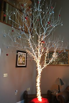 a lighted christmas tree in a living room