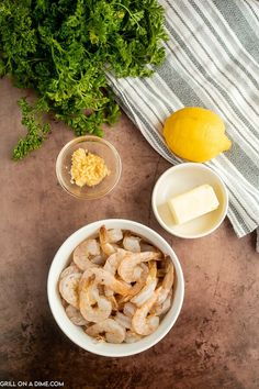 shrimp, cheese and parsley in bowls on a table