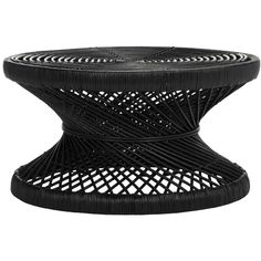 a black wicker table with an intricate design on the top and bottom, sitting on a white background