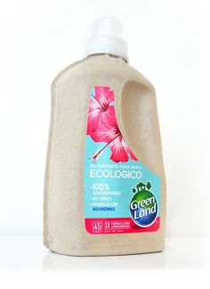 a bottle of ecologico is shown on a white surface with a pink flower