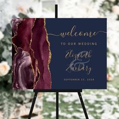 an easel with a sign that says welcome to our wedding and the date is on it