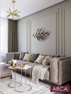 a living room filled with furniture and a chandelier