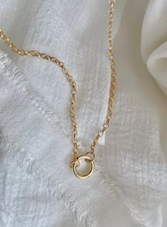 Our rolo chain charm necklace is a beautiful and timeless piece of jewelry that can be customized to suit any individual's style. The chain itself consists of small, round links that are linked together to form a continuous chain. For this necklace layer, we would recommend choosing a chain length that falls between 16-18 inches, as this is a popular length that works well for layering with other necklaces. Depending on your personal preference the size of the charms you choose will vary. As for Dainty Gold Chain Necklace With Round Pendant, Everyday Link Chain Charm Necklace, Round Pendant Charm Necklace With Chain, Minimalist Round Charm Necklaces With Chain, Minimalist Round Charm Necklace With Chain, Everyday Chain Necklace With Round Pendant And Adjustable Chain, Dainty Charm Necklace With Cable Chain And Oval Link, Everyday Charm Necklace With Round Pendant And Delicate Chain, Everyday Chain Necklace With Adjustable Chain And Round Pendant