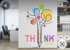 there is a wall sticker with the words think different on it in an office