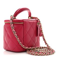 This is an authentic CHANEL Lambskin Quilted Mini Top Handle Vanity Case With Chain in Dark Pink. This stylish crossbody is crafted of luxurious lambskin. The bag features a leather threaded light gold chain-link shoulder strap and light gold hardware. The handbag features a 3/4 wrap-around zipper that opens to a pink leather interior with a mirror. Small Vanity, Pink Shoulder Bag, Mini Top, Vanity Case, Leather Thread, Pink Leather, Leather Interior, Lambskin Leather, Dark Pink