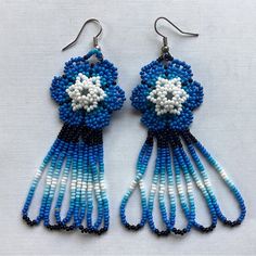 blue and white beaded earrings with flowers on them