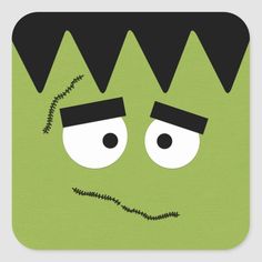 a green square sticker with black hair and eyes